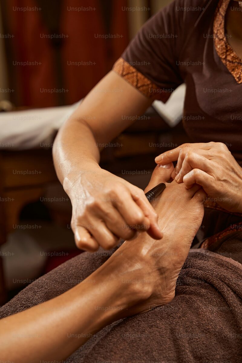 Therapist performing initial signature foot and leg care